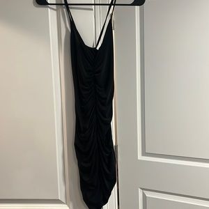 Black mini dress. Ruched front. Spaghetti strap. Size:4